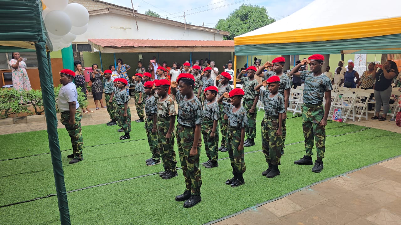 Cadet corps pupils saluting on parade