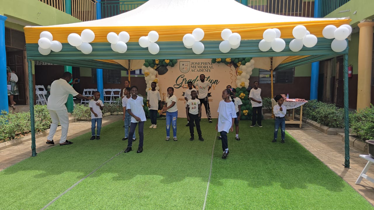 Pupils performing on stage at the graduation ceremony
